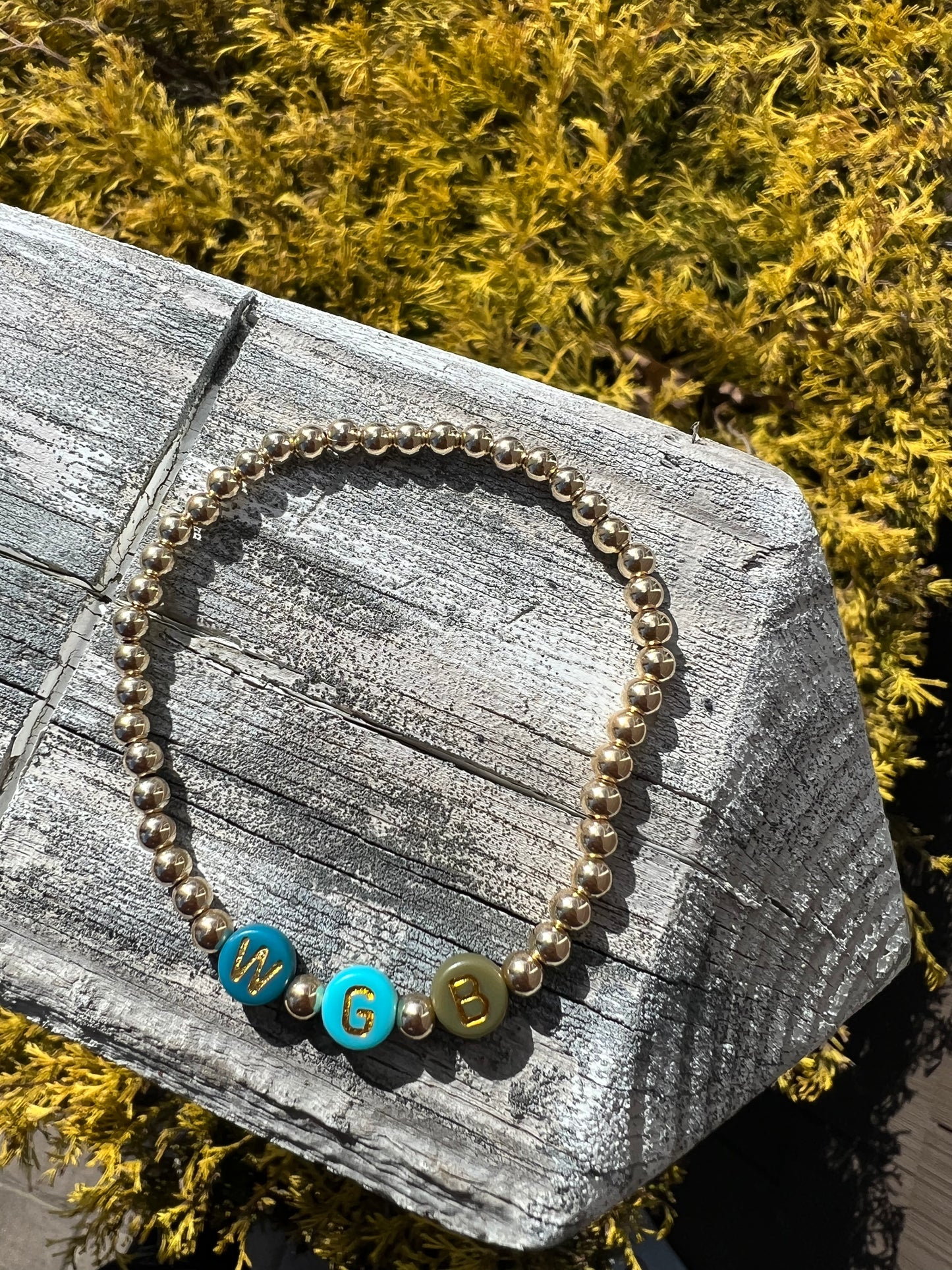 4mm gold ball bracelet with mint, blue, teal and green with gold letters